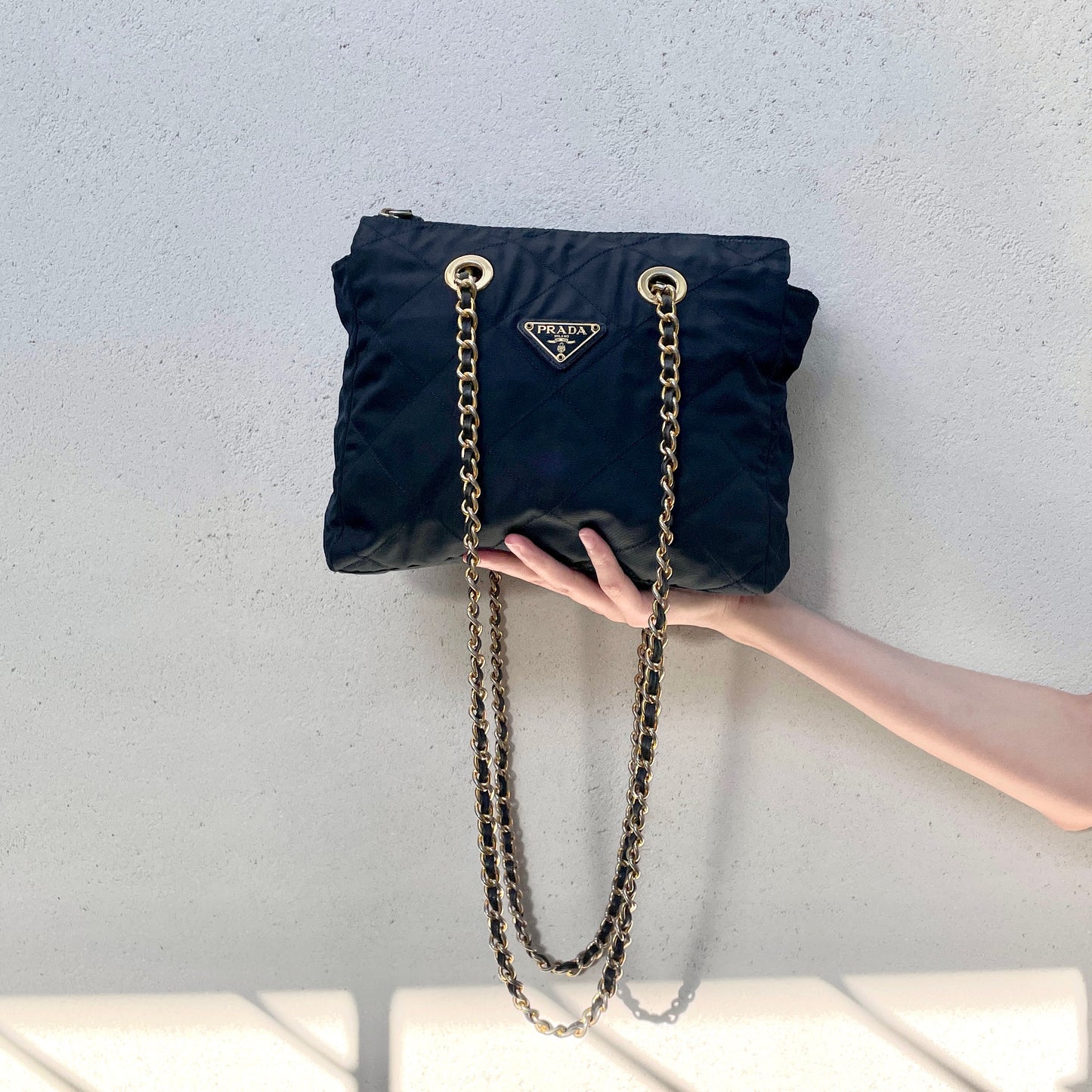 Prada triangle logo chain shoulder nylon tote bag in navy and gold