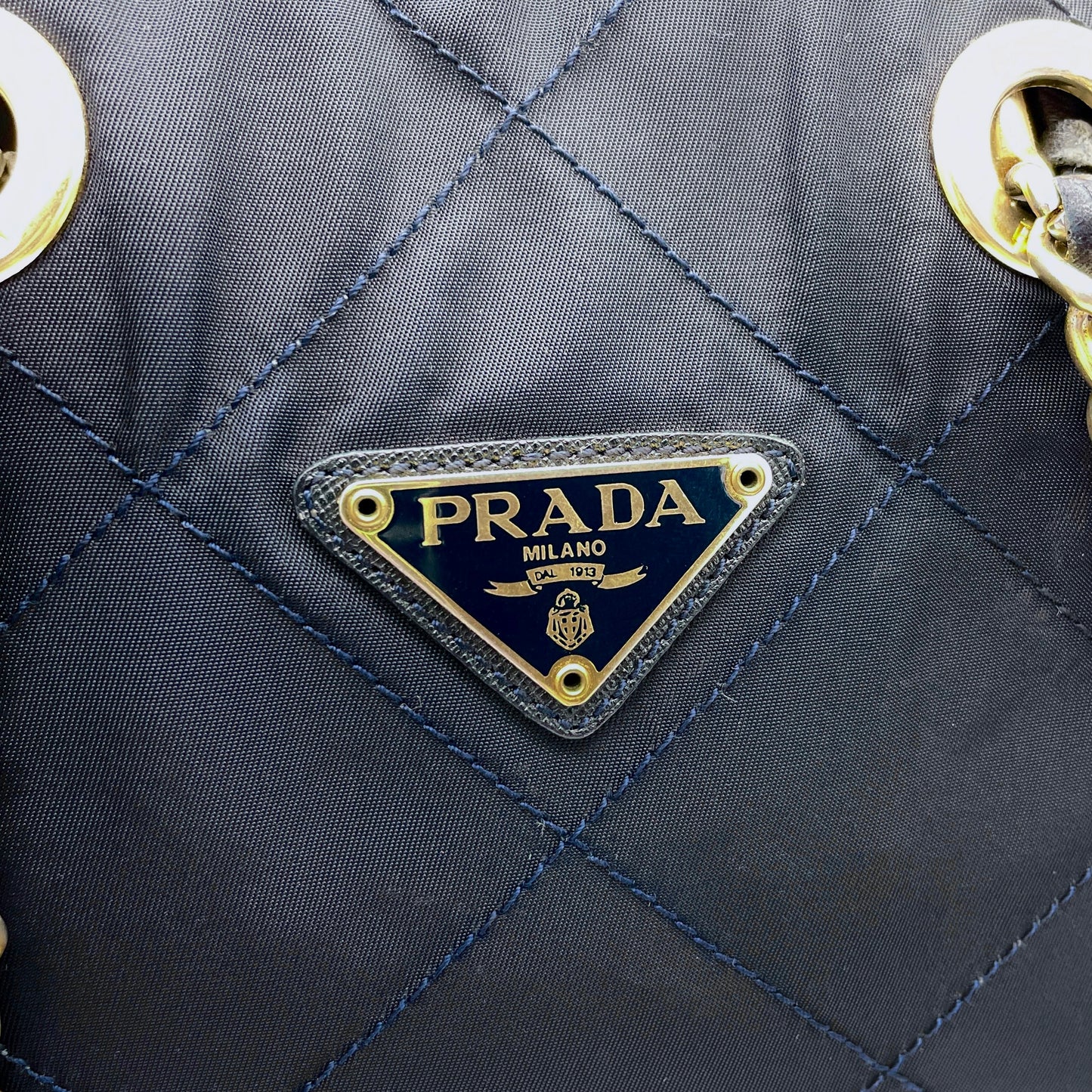 Prada triangle logo chain shoulder nylon tote bag in navy and gold